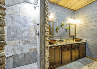 The mixture of stone and wood completes the cabin feel.