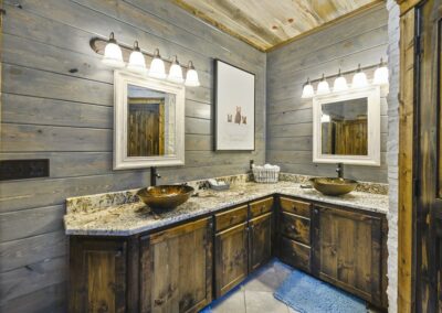 Granite, wood, and whimsical bears give this bathroom personality.